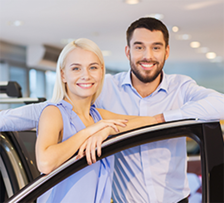 woman and man shopping for a new car