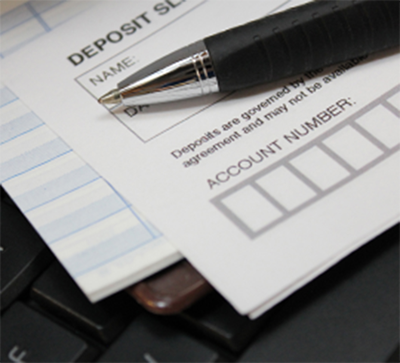 Deposit slip and pen